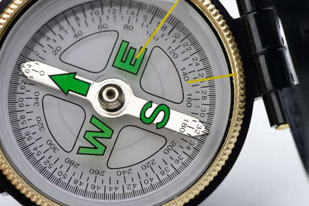 compass. Isolated on white background.Instrument that indicates magnetic northの写真素材