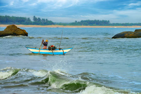 Fisherman sailing on a boat. Indian ocean. Island Sri Lankaの写真素材