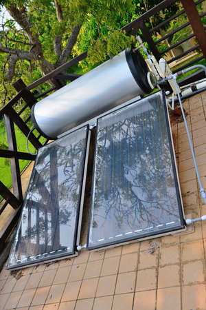solar power panel. On the roof of the building, for water boiler heatingの写真素材