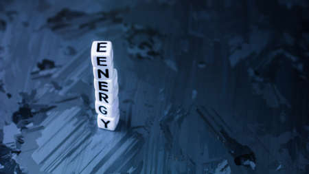 ENERGY cube letter in pile on solar silicon cell surface background. Concept of renewable clean energyの写真素材