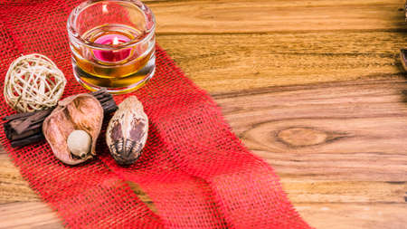 Potpourri and cinnamon sticks on burlap background