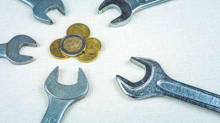 Euro coins and wrench tools as symbol of re-configuration european economicsの写真素材