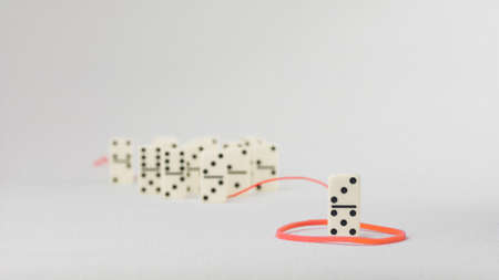 Leadership concept. One domino figure represent major person lead further items in red towの写真素材
