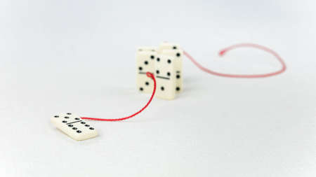 Leadership concept. One domino figure represent major person lead further items in red tow but did...