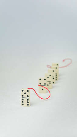 Leadership concept. One domino figure represent major person lead further items in red towの写真素材