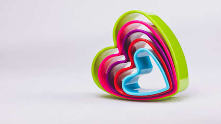 Heart shaped cookie cutter on white backgroundの写真素材