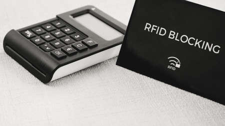 RFID protection sleeve for secure credit card from hacking attack, TAN generator in middle groundの写真素材