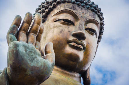 Close up of Tian Tan Buddha with details of hand - The worldss tallest outdoor seated bronze Buddha located in Lantau Island, Hong Kong, Chinaの写真素材