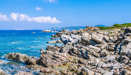 Bizarre granite rocks and amazing azure water on beautiful Sardinia island near Porto Pollo, Sargedna, Italyの写真素材