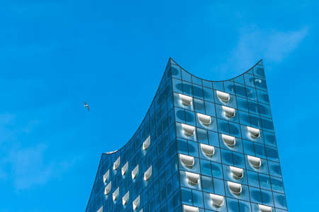 Hamburg, Germany - May 28, 2017: Top shape of Elbphilharmonie with white windows and some white clouds in sky, Hamburg, Germanyのeditorial素材