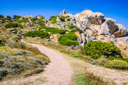 Walky path between bizarre granite rock formations in Capo Testa, Sardinia, Italyの写真素材