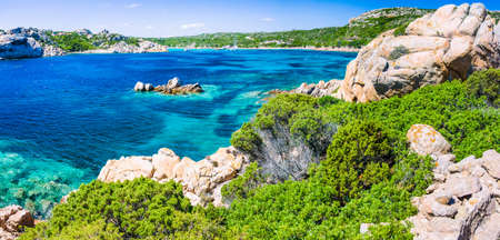 Emerald green sea water and rocks on coast of Maddalena island, Sardinia, Italyの写真素材