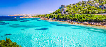 Emerald green sea water and rocks on coast of Maddalena island, Sardinia, Italyの写真素材