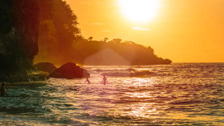 Sunset on beautiful Crystal Bay, Nusa Penida, Bali, Indonesiaの写真素材