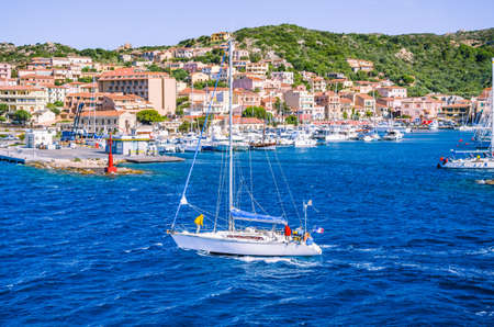 Sailboat in front of Port La Maddalena Island, Sardinia, Italyの写真素材