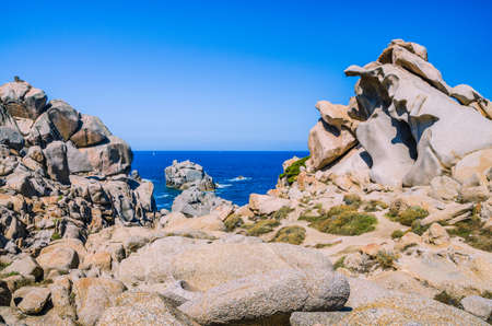 Path betweeen bizarre granite rock formations in Capo Testa, Sardinia, Italyの写真素材