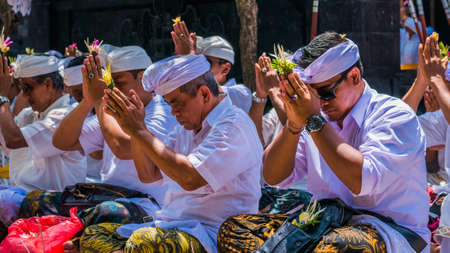 GOA LAWAH, BALI, INDONESIA - November 3, 2016: Balinese praying on ceremony at Pura Goa Lawah temple, Bali, Indonesiaのeditorial素材