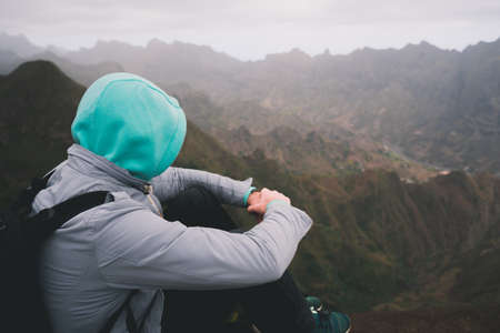Traveler enjoying magnificent remote moment above huge mountain ranges on Santo Antao island, Cape Verdeの写真素材