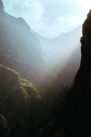 Mysterious light rays on the slopes of the rocks in huge canyon on Santo Antao island, Cape Verde, Cabo Verdeの写真素材