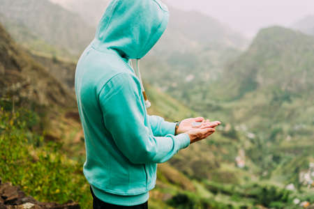Man explorer holding compass and find path in mountainous terrain on Santo Antao Island. Cape Verde. Kapverdenの写真素材