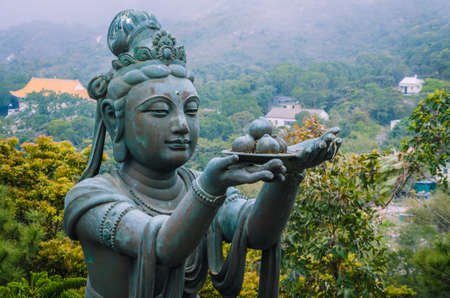 Bronze buddhistic statues praising and making offerings to the Tian Tan Buddha - Big Buddha