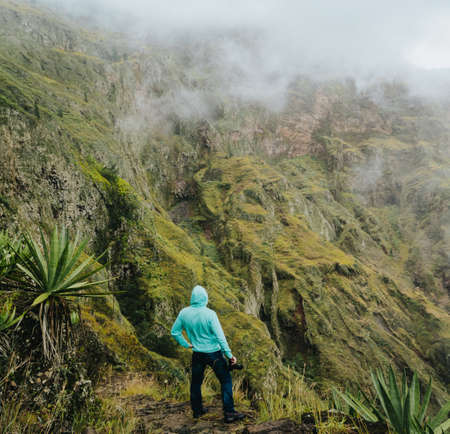 Taking photo on the edge of of gorgeous canyon valley on the path from Xo-Xo Valley. Santo Antao...