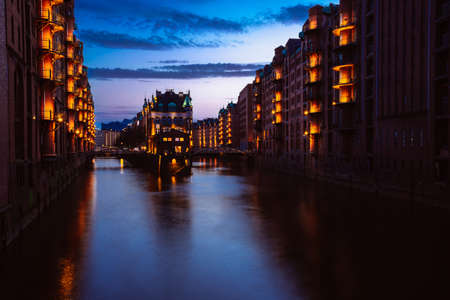 Blue hour in Warehouse District - Speicherstadt. Tourism landmark of Hamburg in twilight. View of...