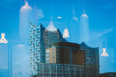 Hamburg, Germany - May 17, 2018: Elbphilharmonie, Close up shot - bright blue sky and bright sun light and flares from behind, Hamburg, Germanyのeditorial素材