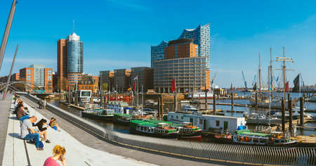 Hamburg, Germany - May 17, 2018: Panorama of hafencity - blue sky bright sky, business trade...
