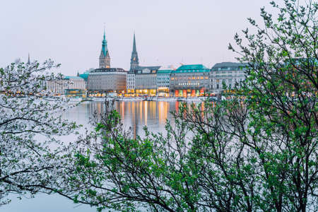 Beautiful view of Hamburg town hall - Rathaus and Alster river at spring earning eveningの写真素材