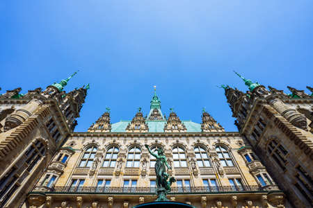 Roof shape view of the beautiful famous Hamburg town hall with Hygieia fountain from courtyard near market square and lake Binnenalster in Altstadt quarter, Hamburg, Germanyの写真素材