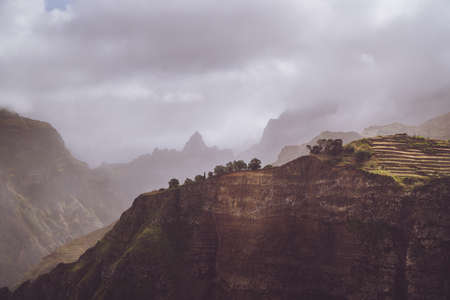 Scenery with shape of huge rocks and motion clouds mist on sky. Surreal moment before a thunderstorm in the mountains on Santo Antao Cape Verdeの写真素材