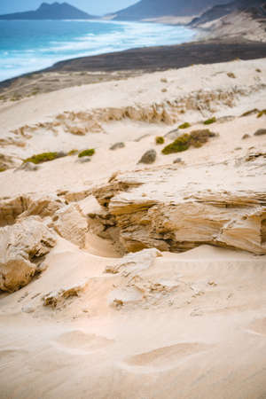 Surreal sand rocky stone in the dune on the Atlantic coastline on Baia Das Gatas. North of Calhau, Sao Vicente Island Cape Verdeの写真素材