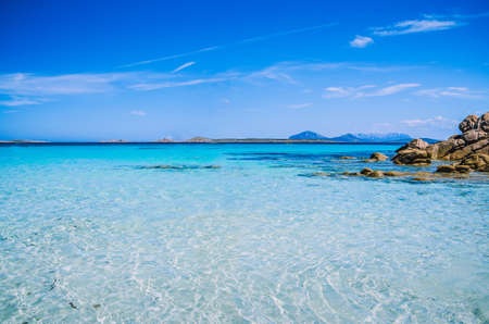 Clear amazing azure coloured sea water with granite rocks in Capriccioli beach, Sardinia, Italyの写真素材