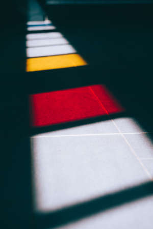 Colored windows light on the ground of an subway