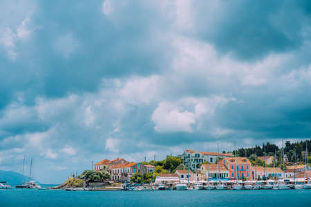Cloudscape over sea and Fiskardo village, Kefalonia Island Greece