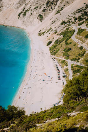 Myrtos beach, Kefalonia island, Greece. Beautiful top view of bay and beach with tourists from aboveの写真素材