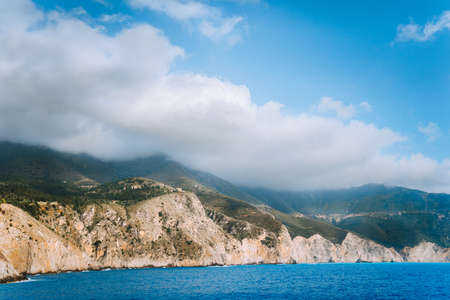Picturesque rocky coastline on Kefalonia island. Amazing landscape in soft light with cloudscapeの写真素材