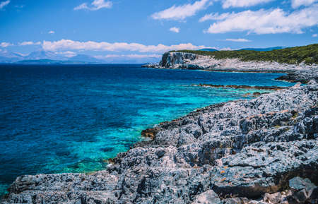 Amazing view of crystal clear blue water and breathtaking cliffs in Greece. Greek seascapeの写真素材