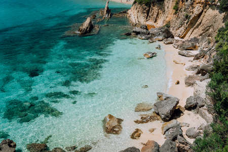Hidden empty beach with pure clear turquoise sea water near white rock cliffs located in famous beach of Platys and Makrys gialos, Argostoli, Cefalonia island, Ionian, Greeceの写真素材