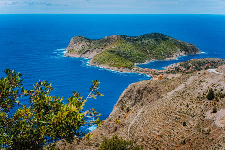 Picturesque view of sunny Assos village and blue sea bay. Kefalonia island, Greeceの写真素材