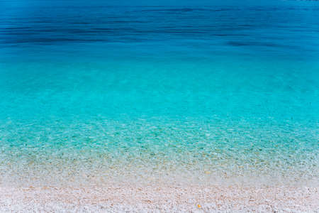 Abstract image of clear blue sea water beautiful background decoration of summer time. Clear transparent water. Play of colours. Wallpaper. Idyllic Summer vacation consept, Greeceの写真素材