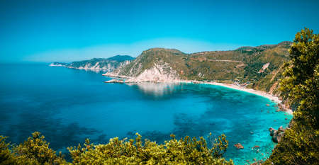 Panorama View to Petani beach with transparent and crystal clear blue mediterranean sea water in picturesque bay, Kefalonia island, Greeceの写真素材