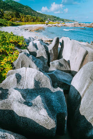 Lovely tropical beach with unique granite formations in south-west of La Digue island, Anse aux...