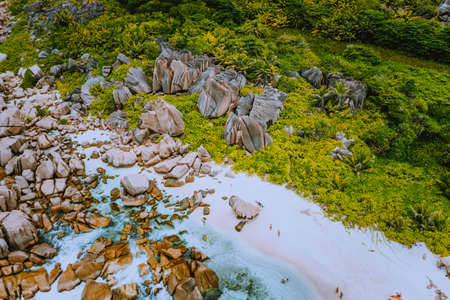 Aerial view of Seychelles tropical Marron beach at La Digue island. White sand beach with turquoise...