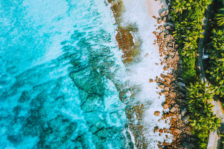 Aerial photo of bizarre paradise tropical beach Anse Bazarca at Mahe island, Seychelles. Summer...