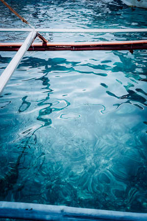 Blue rippled sea water surface near Banca boat. El Nido, Palawan, Philippines. Vintage lookの写真素材