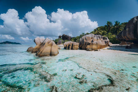 Impressive cloudscape above Anse Source DArgent tropical beach, La Digue Seychelles. Luxury exotic travel conceptの写真素材