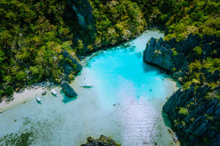Amazing aerial view of turquoise Cadlao lagoon hopping island El Nido Palawan Philippines. Stunning nature placeの写真素材