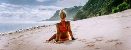 Tanned blonde tourist woman on summer vacation, beach, Bali. Travel wanderlust vacation conceptの写真素材